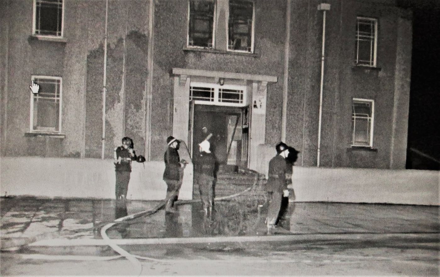 Firefighters outside the Canon's Hall after the fire