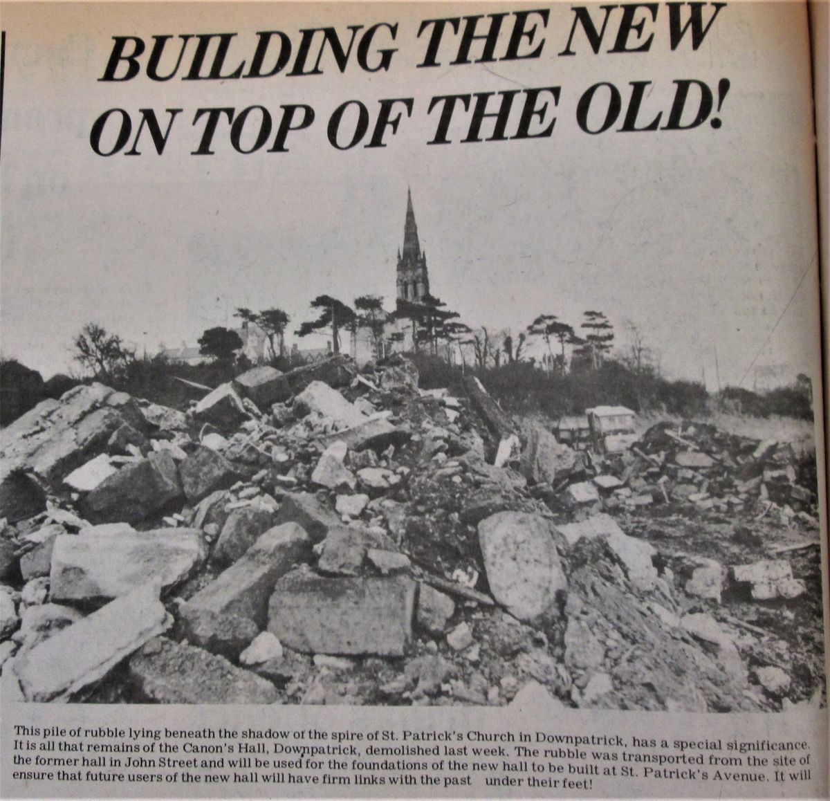 Newspaper clipping showing the demolished hall beneath the spire of St Patrick's, headlined Building the new on top of the old