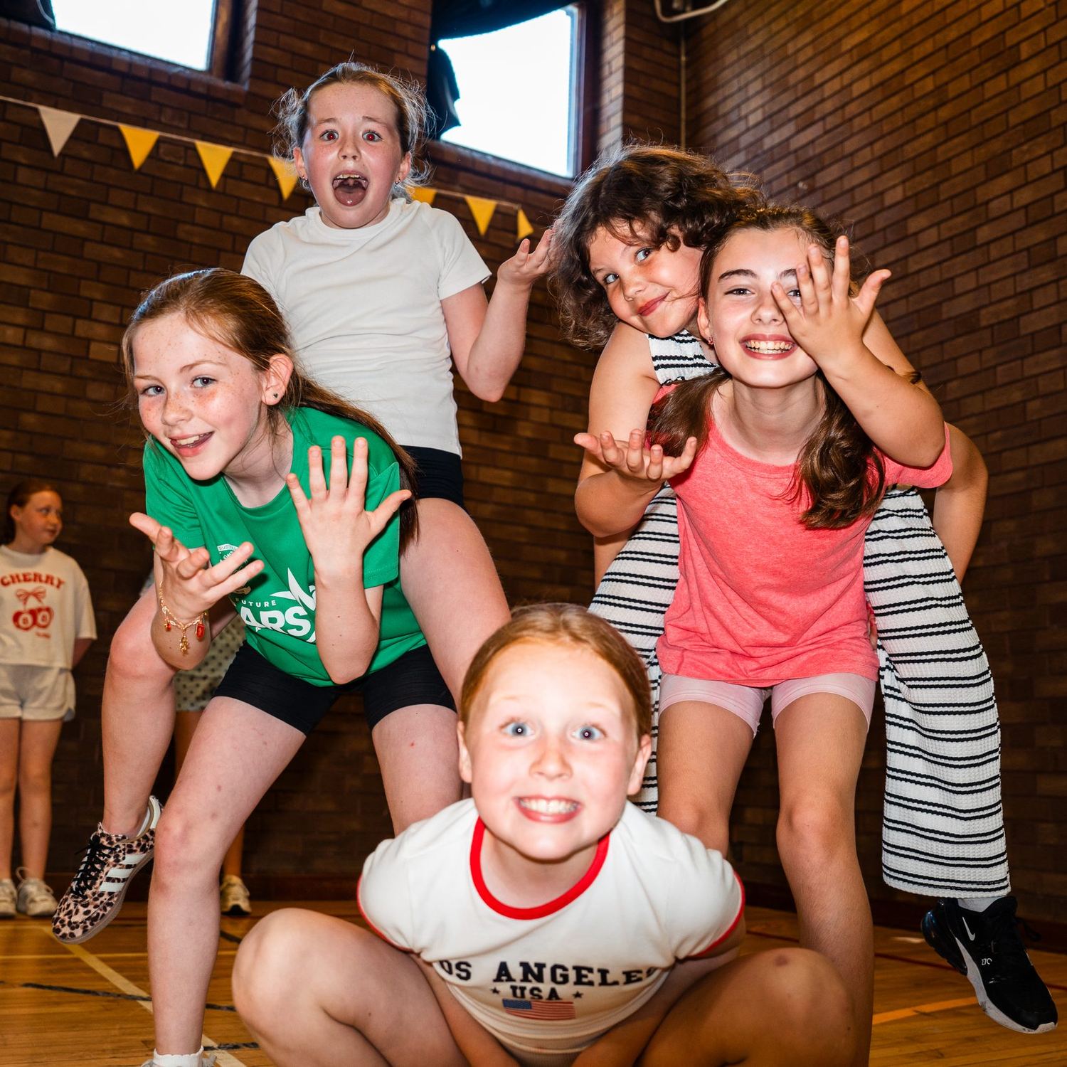 Young members laughing together at the PYC summer programme